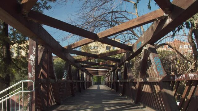 Lonely moderm wooden bridge above a highway
