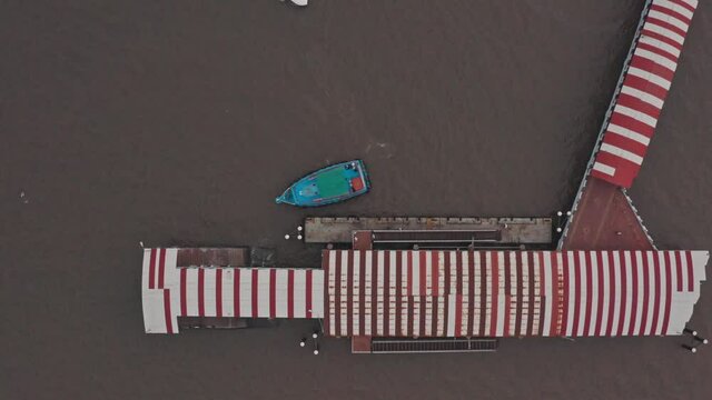 Top down drone shot of passenger and speed boat docking at mandwa jetty India