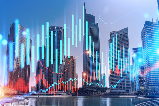 Skyscrapers of Dubai business downtown. International hub of trading and financial services of Western Asia. FOREX graph and chart concept. Double exposure. Dubai Canal waterfront.