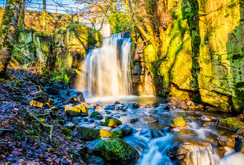A long exposure view of an upper waterfall section at Lumsdale on Bentley Brook, Derbyshire, UK