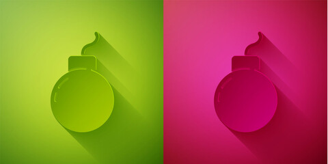 Paper cut Bomb ready to explode icon isolated on green and pink background. Paper art style. Vector.