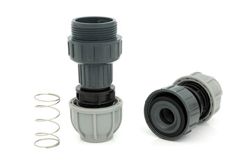 Plastic MDPE non return value compression fitting showing internal spring used in plumbing to...