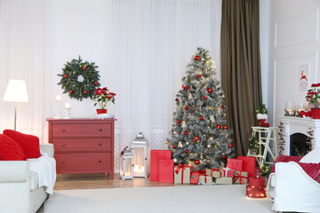 Living room with fireplace and Christmas decorations. Festive interior design