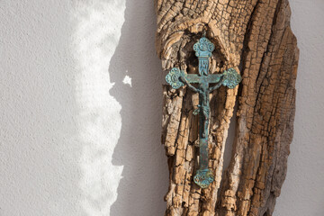 The old brass pectoral cross on the old wood.