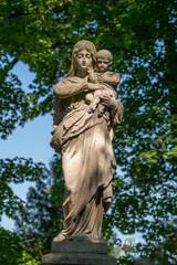 Fototapeta na wymiar Ancient statue Virgin Mary and baby Jesus Christ. Religion, faith, eternal life, God, the soul concept.