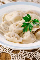 Traditional meat dumplings decorated with parsley. Close up