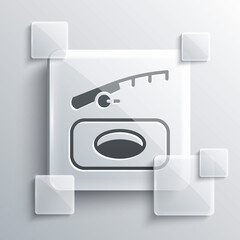 Grey Winter fishing icon isolated on grey background. Square glass panels. Vector.