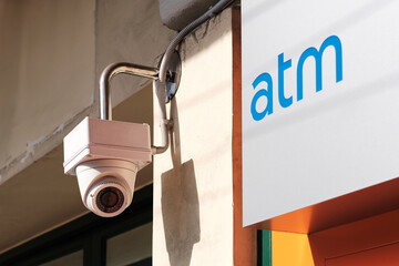 Security camera or cctv camera surveillance installed on the atm bank machine . 