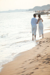 Young Couple in Wedding Dress on beach