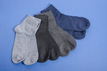 Classic mens multicolored socks on a blue background