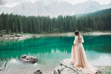Beauty woman, bride with perfect white dress background mountains