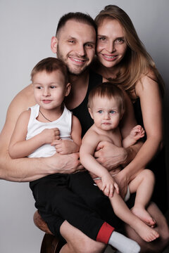 Portrait of a beautiful young family. Dad, mom, two children