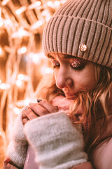 portrait of a girl in a hat 
in the street in white gloves
