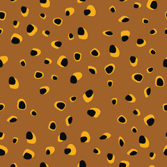 Trendy seamless pattern of yellow brown leopard spots for holiday wrapping paper, fabric, textile, bedding, bedspread. Vector illustration.