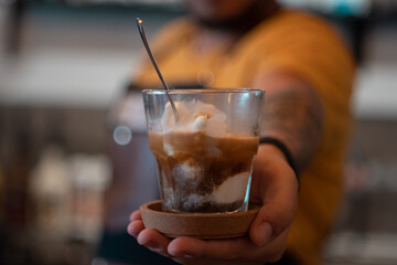 man holding a cup of coffee