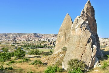 Amazing Cappadocia rocky outdoor landscape, selective focus. Tuff caves, Goreme, Cappadokia, Turkey. Turkish sightseeing attraction. Vertical position 