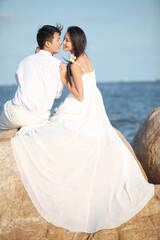 Young Couple in Wedding Dress on beach