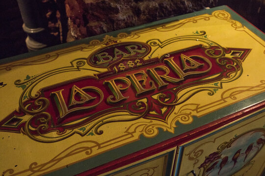 Old decorated wooden sideboard used in the Bar "La Perla", located in the neighborhood of La Boca in Buenos Aires