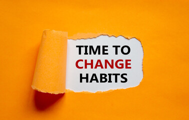 Time to change habits symbol. The text 'Time to change habits' appearing behind torn orange paper. Business, growth and time to change habits concept. Copy space.