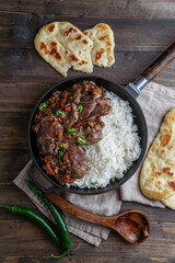 pakistani indian food - lamb with rice and flat bread