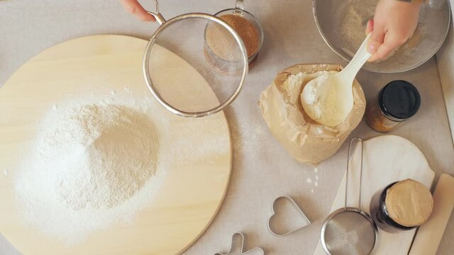 Making cake batter, sifting flour to make it more airy. slow motion. Step by Step recipe for making Sweet Christmas Cookie Dough