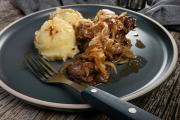 Fried liver with onion.