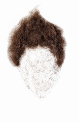 Obraz na płótnie Canvas Cut off hair arranged into head shape. reminder to go to hairdresser.