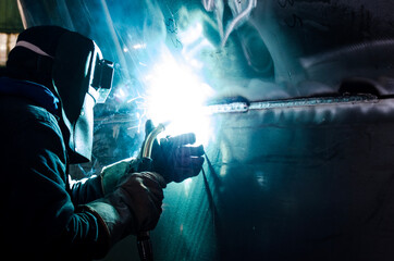 Fototapeta welder at work with aluminum welding obraz