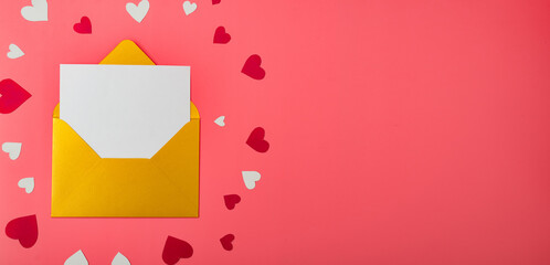 Gold envelope and hearts on a red background. Love letter for valentine's day concept. Place for your text. Banner.
