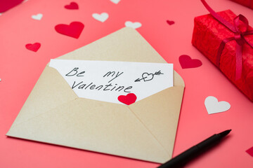 Be my Valentine - love letter on a red background with hearts.