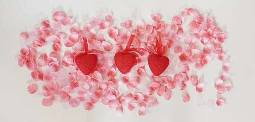 Three Red Hearts with Pink Petals on White
