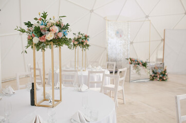 Decorated decorated tables at the wedding