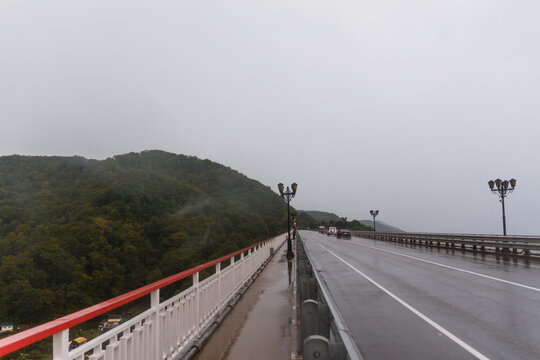 Mountain scenic asphalt road after rain. bridge