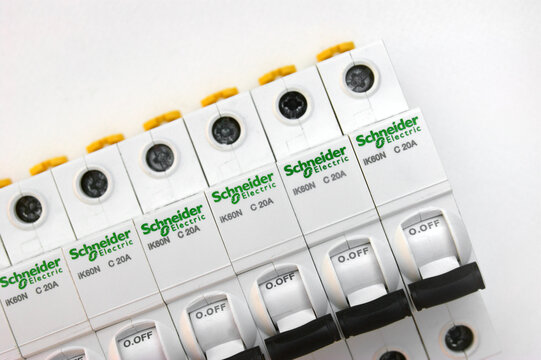 Schneider electric circuit breakers on white background.