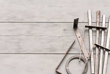 Metal pieces on the gray background with copy space. Ferrous metal background.