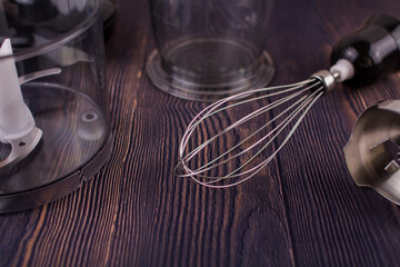 blender and whisk on a wooden table