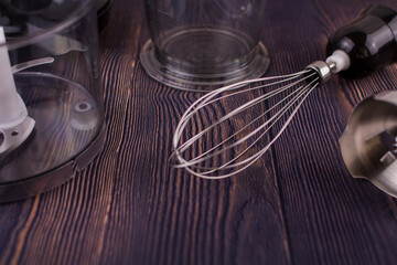 blender and whisk on a wooden table