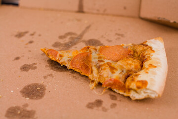 last slice of salami pizza in a box