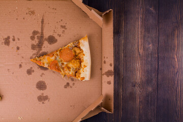 last slice of salami pizza in a box