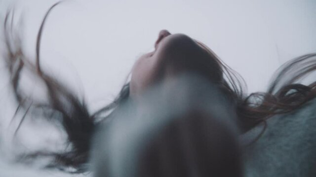 A woman's hair blows in the wind