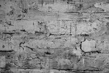 Texture of a brick wall with cracks and scratches which can be used as a background