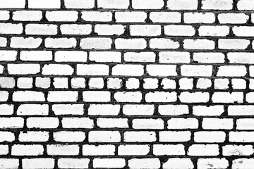 Texture of a brick wall with cracks and scratches which can be used as a background