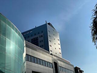 Buildings, set against a vivid blue sky, near the centre of, Bradford, Yorkshire, UK