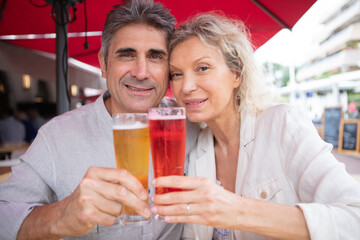 portrait of mature couple with drinks