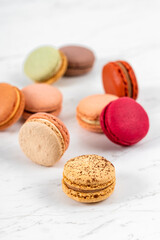Colorful Fruity Macarons Flat Lay and Top View on White Marble Table