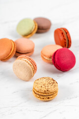 Colorful Fruity Macarons Flat Lay and Top View on White Marble Table
