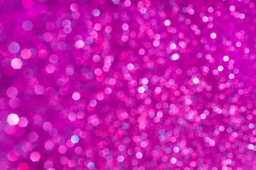 Abstract purple and pink glitter lights background. Circle blurred bokeh. Romantic backdrop for Valentines day, womens day, holiday or event