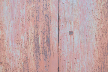 Scratched red-painted metal background. Abstract vintage texture.
