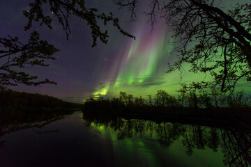 Northern lights over slow running river