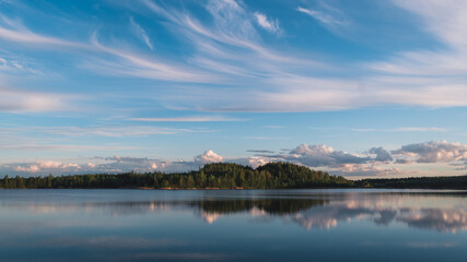 Fototapeta na wymiar Smooth Lake with a Beautiful Reflection